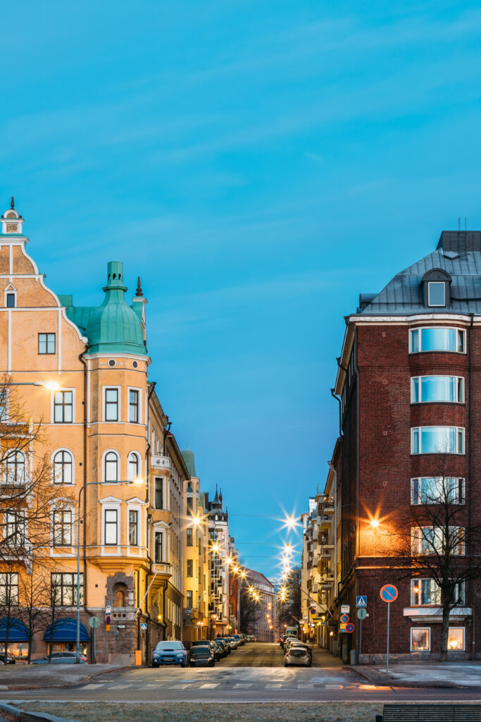 Helsinki, Finland. Residential House Building At Intersection Of Merikatu, Neitsytpolku And Puistokatu Streets In Winter Morning Evening. Ullanlinna Neighbourhood, District